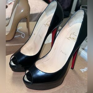 Christian Louboutin Black Peep-Toe Heels with Red Sole.